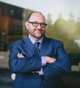 about us elliot silver headshot 659 critical desktop.jpg